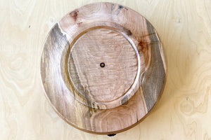 Upside down picture of Circle Factory bowl in Maple by Geoarge Peterson is a blonde wood apple bowl with repairs deatail.