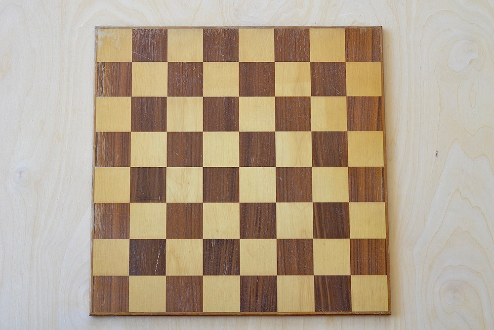 Solid wood chess board in walnut and maple.