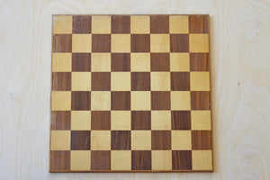 Solid wood chess board in walnut and maple.