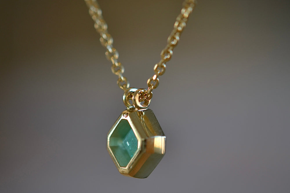 
            
                Load image into Gallery viewer, Side view of the Duo bale offset Emerald necklace by Elizabeth Street Jewelry. 
            
        