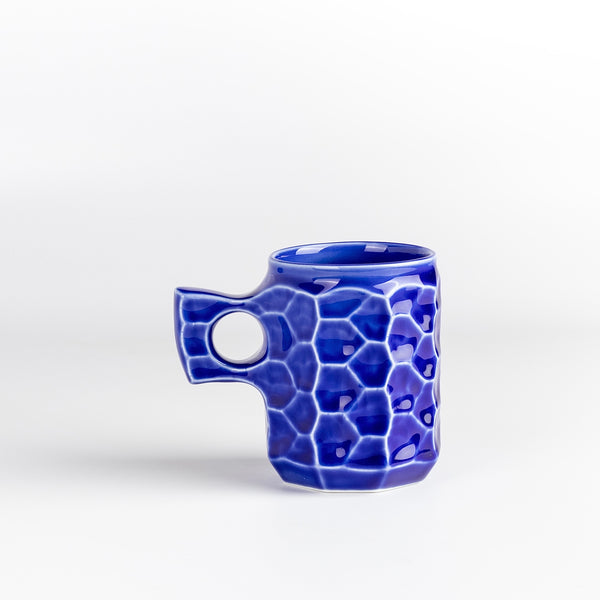 Large Cobalt Blue Ceramic Jincup from Akihiro Woodworks is a collaboration with One Kiln Ceramics utilizing porcelain mud casting and local wood ash in the glaze to achieve the color. Each mug is slightly different from another. Made by Akihiro Woodworks in Kagoshima, Japan.