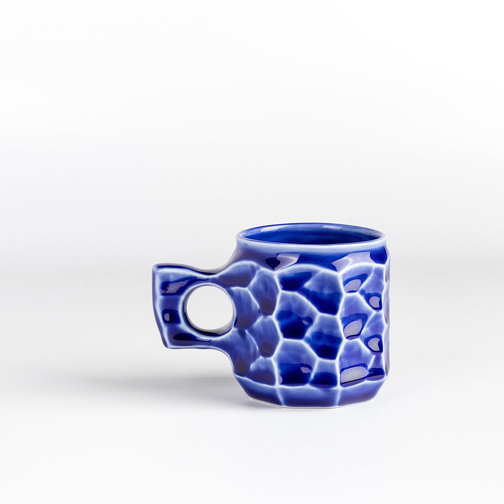 Medium Cobalt Blue Ceramic Jincup from Akihiro Woodworks is a collaboration with One Kiln Ceramics utilizing porcelain mud casting and local wood ash in the glaze to achieve the color. Each mug is slightly different from another. Made by Akihiro Woodworks in Kagoshima, Japan.