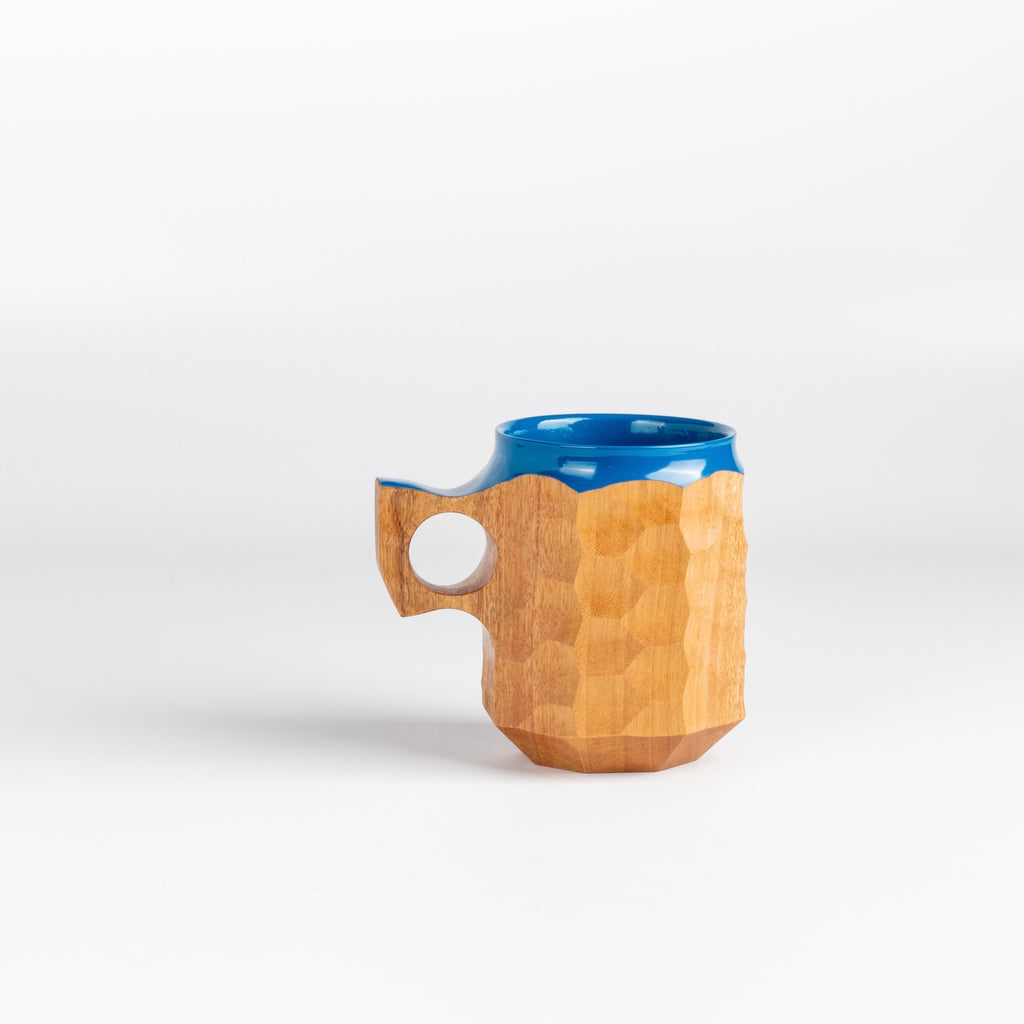 Large Hybrid Blue Urushi Jincup from Akihiro Woodworks is a hand carved tabunoki wood mug with vibrant blue lacquer on the rim and inside. The wood will darken over time. Made by Akihiro Woodworks in Kagoshima, Japan.