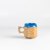 Medium Hybrid Blue Urushi Jincup from Akihiro Woodworks is a hand carved tabunoki wood mug with vibrant blue lacquer on the rim and inside. The wood will darken over time. Made by Akihiro Woodworks in Kagoshima, Japan.