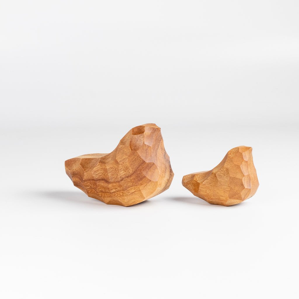 Medium and small Carved Wood Birds "Chicchi" from Akihiro Woodworks is a hand carved bird in tabunoki wood that will sway back and forth when you push on it. Each bird is unique and may vary in color and the appearance of knots in the wood. Made by Akihiro Woodworks in Kagoshima, Japan.