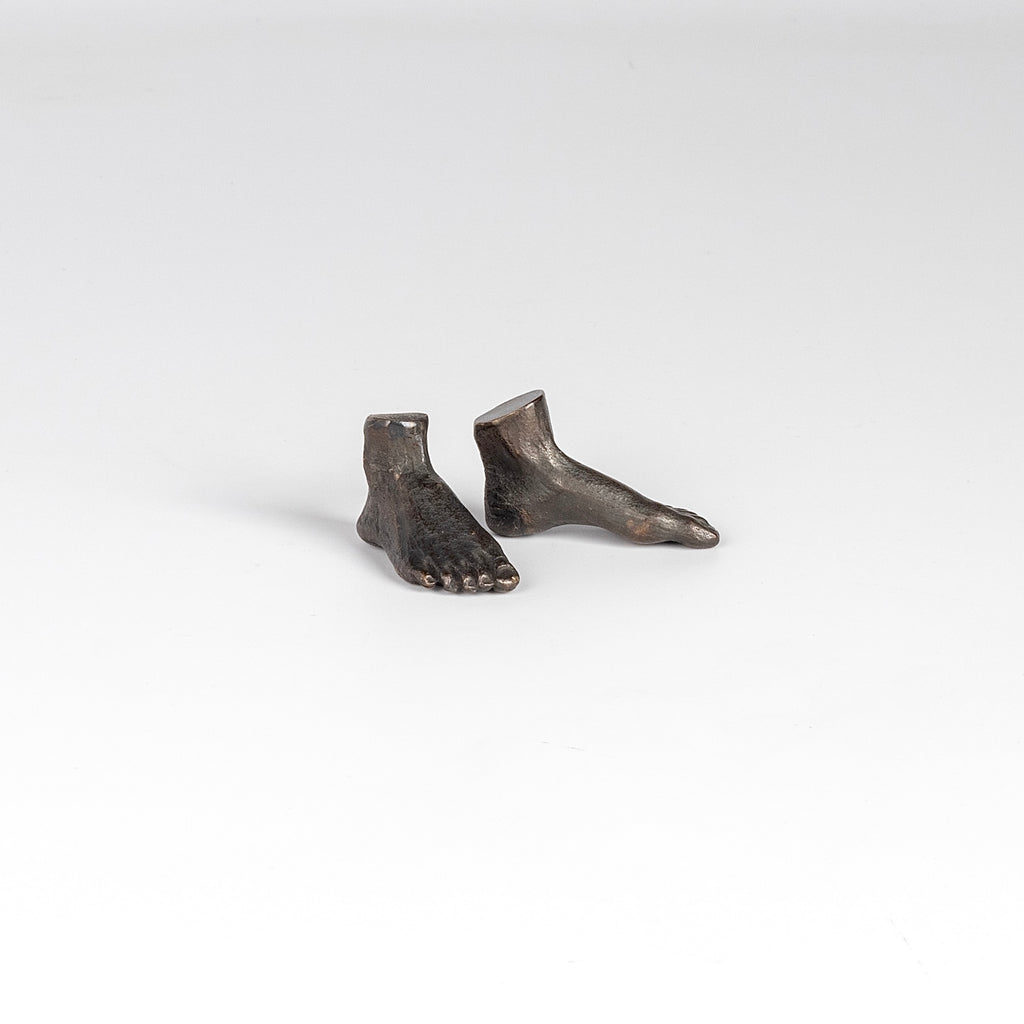 Bronze Objecs Pair of feet "Standing Still" is a sculpture of a pair of feet cast in bronze with patina handmade and designed by Anne Ricketts.