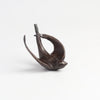 Bronze Object "Coming Home" (flying swallow) on white background by Anne Ricketts.