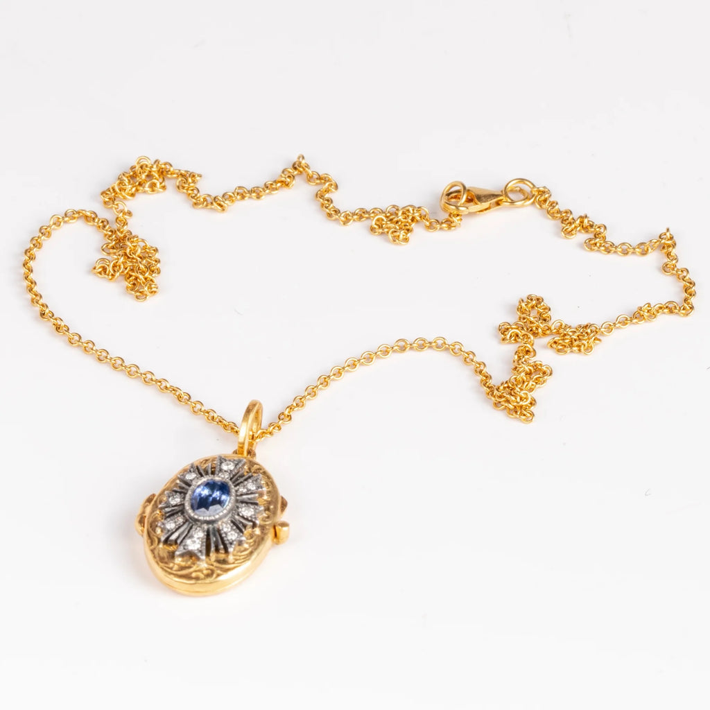 Arman Sarkisyan Blue sapphire locket in 22k yellow gold with diamonds on white background.
