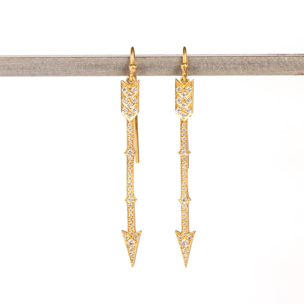 Arrow drop earrings in 18k with diamonds by Arman Sarkisyan are 45mm long arrowns in gold with white round cut diamonds on french hooks.