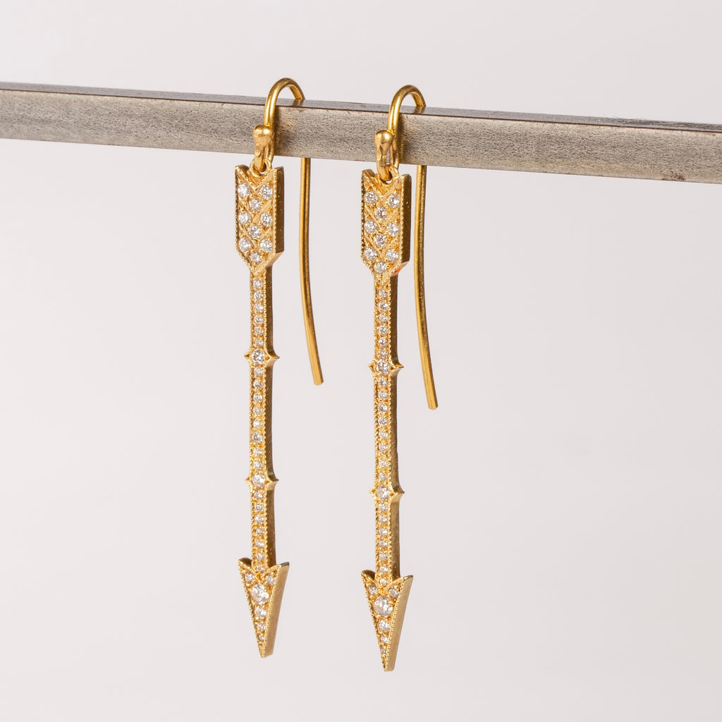 Side view of arrow drop earrings in 18k with diamonds by Arman Sarkisyan.