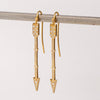 Side view of arrow drop earrings in 18k with diamonds by Arman Sarkisyan.