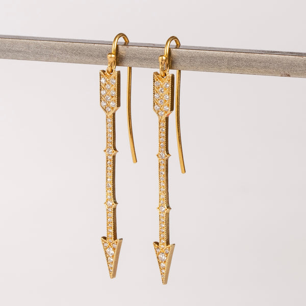 Side view of arrow drop earrings in 18k with diamonds by Arman Sarkisyan.