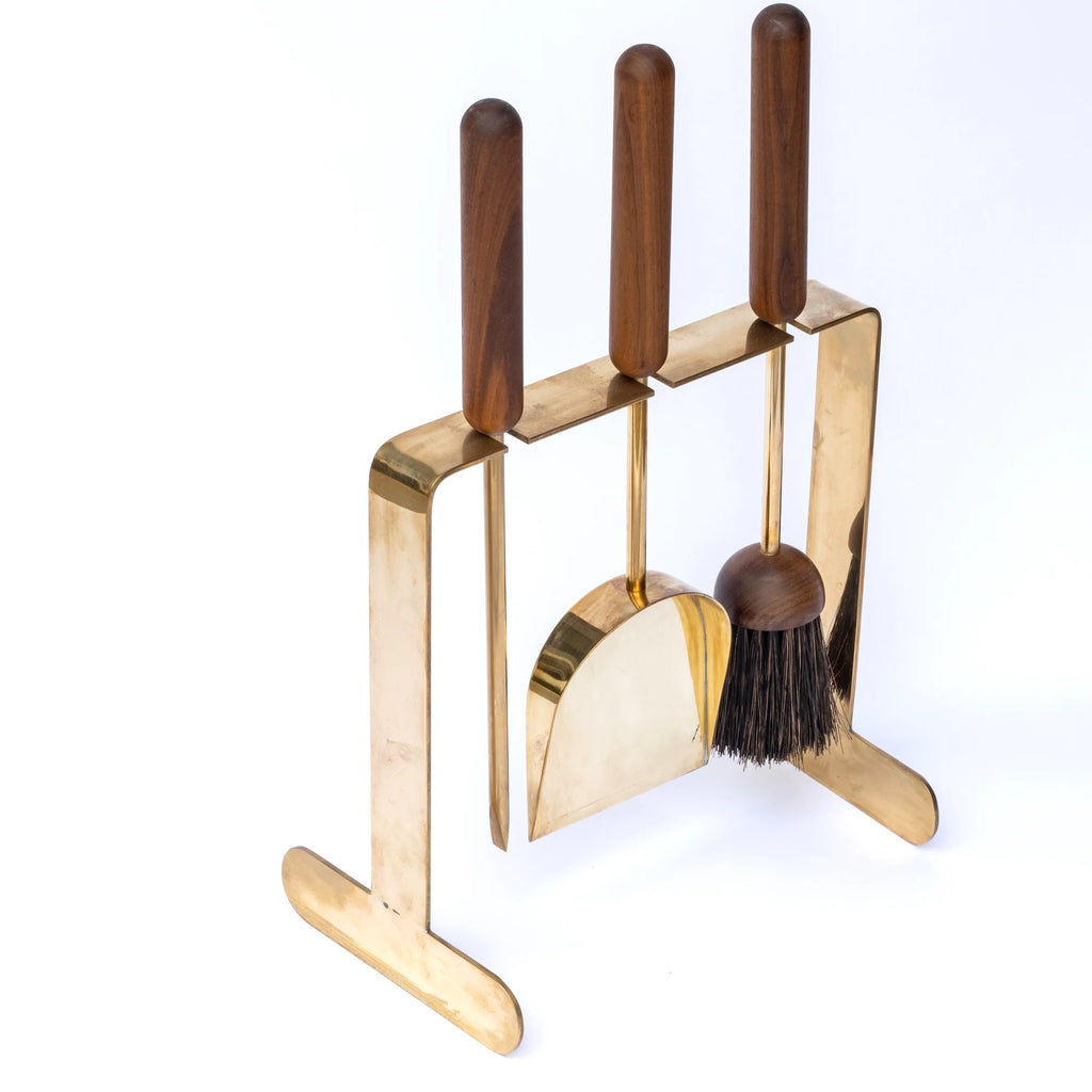 Carl Aubock Brass fireplace tool set with wooden handles on a white background
