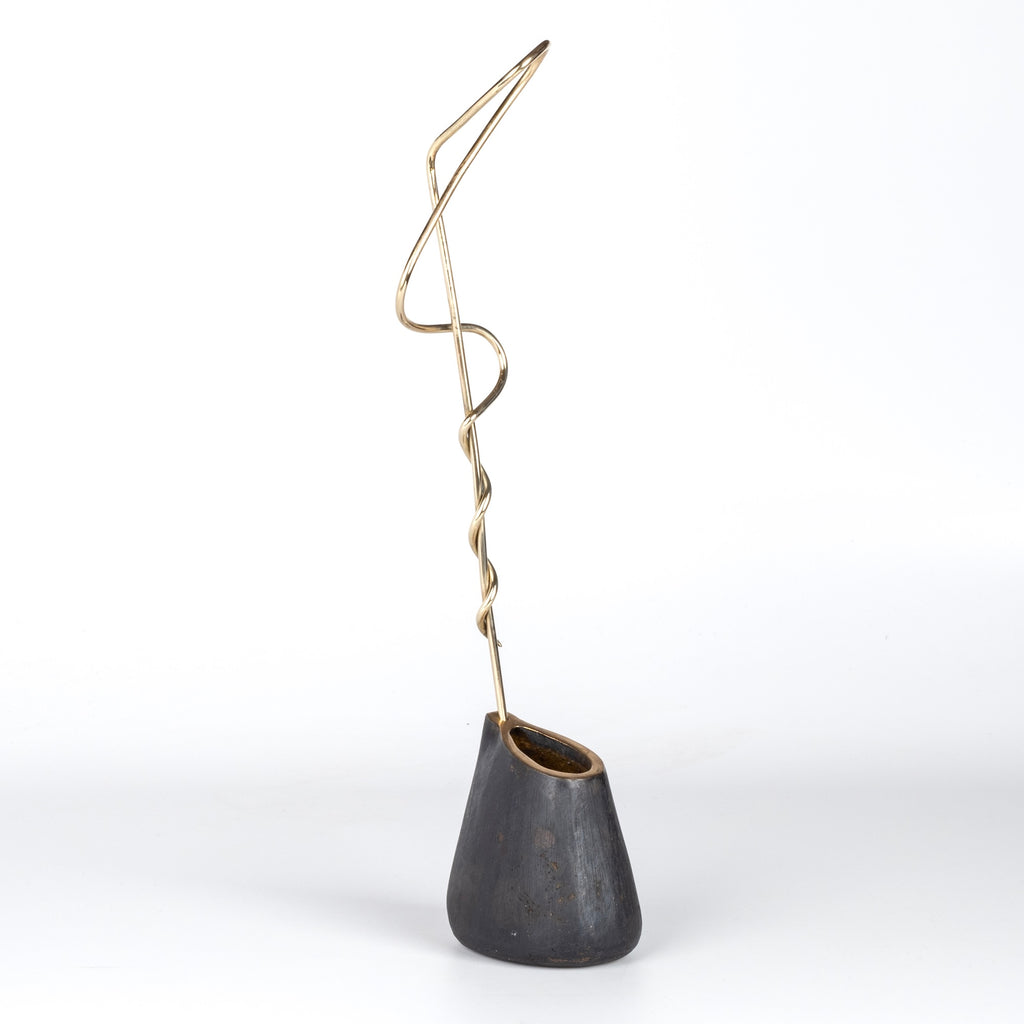 Aubock Vase 7240 Single Noose is a brass vase with patinated body, polished rim and rod. Designed by Carl Auböck and handmade in Austria. Founded in 1906, the workshop is still owned and operated by the Auböck family (by Carl IV and V) from its original home, in a Vienna townhouse.
OK has the largest selection of current Werkstätte Auböck production in the US and in stock, ready to ship.