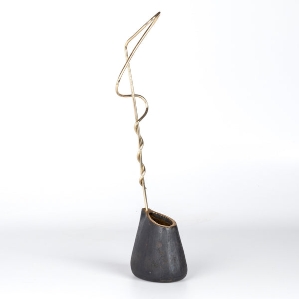 Aubock Vase 7240 Single Noose is a brass vase with patinated body, polished rim and rod. Designed by Carl Auböck and handmade in Austria. Founded in 1906, the workshop is still owned and operated by the Auböck family (by Carl IV and V) from its original home, in a Vienna townhouse.
OK has the largest selection of current Werkstätte Auböck production in the US and in stock, ready to ship.