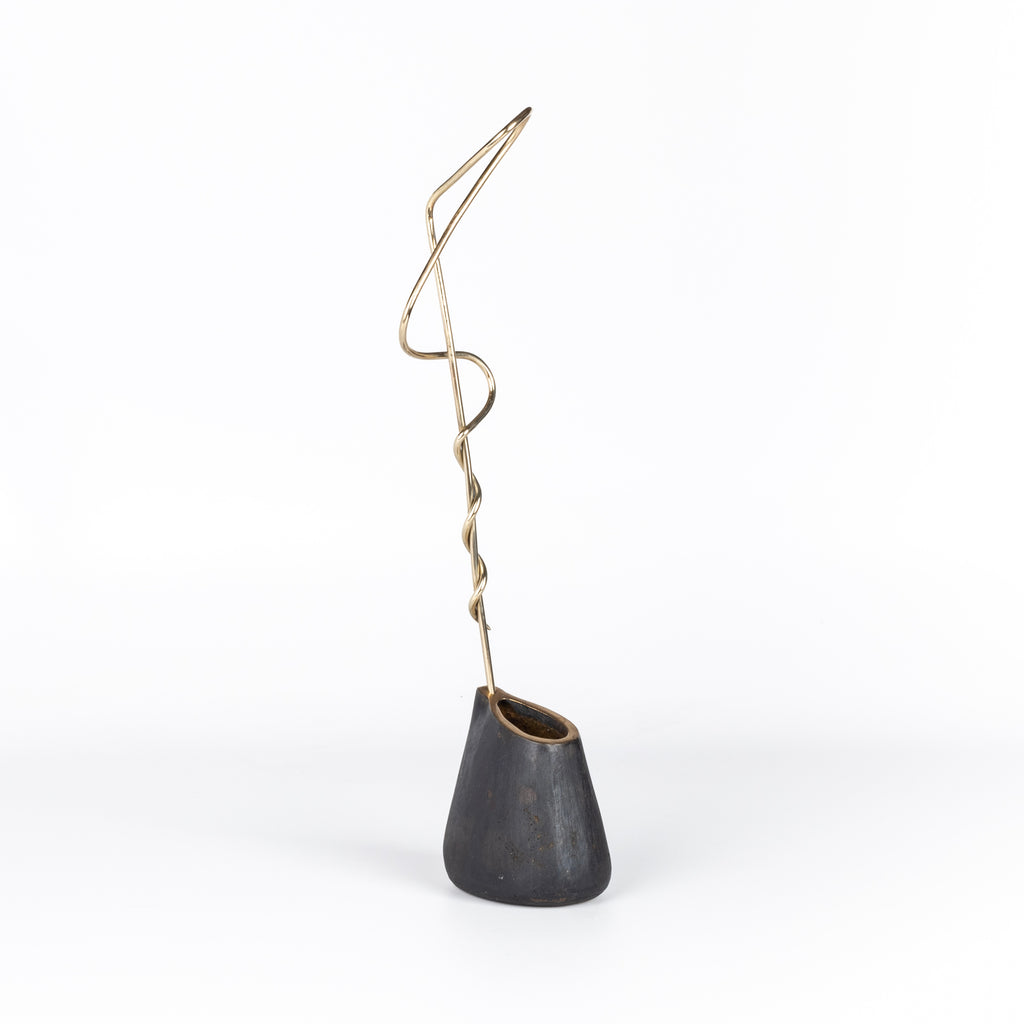 Aubock Vase 7240 Single Noose is a brass vase with patinated body, polished rim and rod. Designed by Carl Auböck and handmade in Austria. Founded in 1906, the workshop is still owned and operated by the Auböck family (by Carl IV and V) from its original home, in a Vienna townhouse.
OK has the largest selection of current Werkstätte Auböck production in the US and in stock, ready to ship.