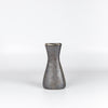 Another angle on Werkstatte Carl Aubock Vase 7231 called Hourglass in patina brass with polished rim on white.