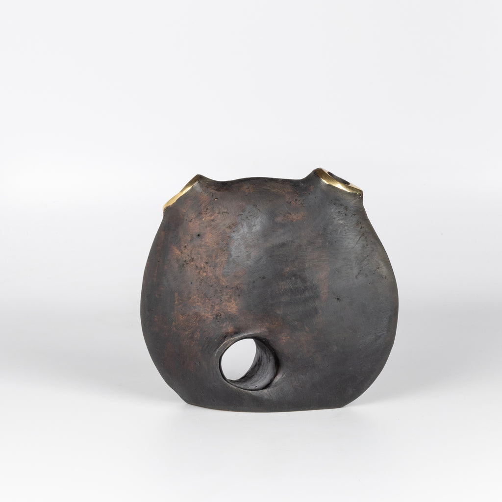 Aubock Vase 3789 Moon is a brass vase with patinated body and polished rim.
Designed by Carl Auböck and handmade in Austria. Founded in 1906, the workshop is still owned and operated by the Auböck family (by Carl IV and V) from its original home, in a Vienna townhouse.
OK has the largest selection of current Werkstätte Auböck production in the US and in stock, ready to ship.