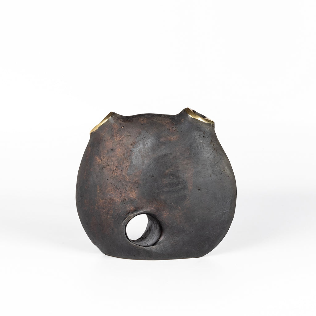 Aubock Vase 3789 Moon is a brass vase with patinated body and polished rim.
Designed by Carl Auböck and handmade in Austria. Founded in 1906, the workshop is still owned and operated by the Auböck family (by Carl IV and V) from its original home, in a Vienna townhouse.
OK has the largest selection of current Werkstätte Auböck production in the US and in stock, ready to ship.