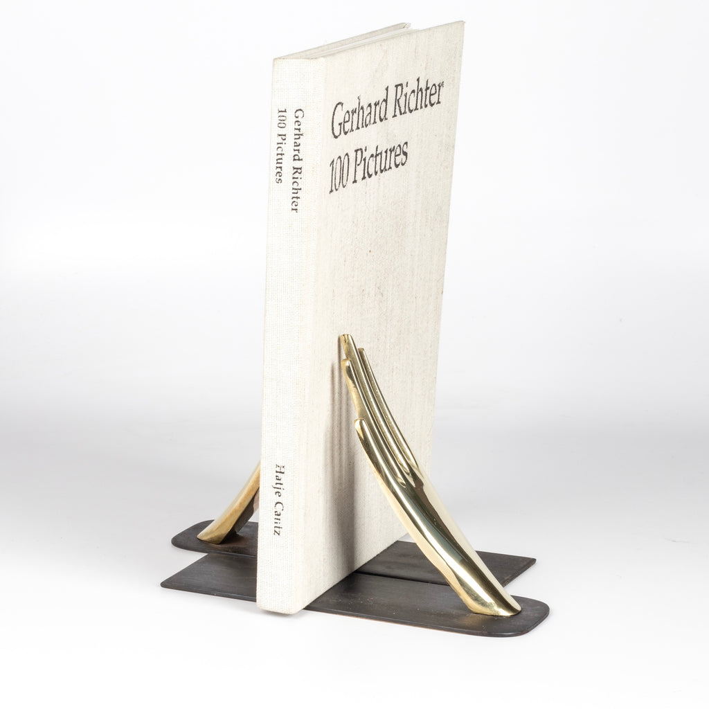 Aubock Bookends 1928 Hands bookends are polished and hand shape bookends 1928 with patinated base. Designed by Carl Auböck and handmade in Austria. Founded in 1906, the workshop is still owned and operated by the Auböck family (by Carl IV and V) from its original home, in a Vienna townhouse. OK has the largest selection of current Werkstätte Auböck production in the US and in stock, ready to ship.