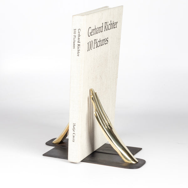 Aubock Bookends 1928 Hands bookends are polished and hand shape bookends 1928 with patinated base. Designed by Carl Auböck and handmade in Austria. Founded in 1906, the workshop is still owned and operated by the Auböck family (by Carl IV and V) from its original home, in a Vienna townhouse. OK has the largest selection of current Werkstätte Auböck production in the US and in stock, ready to ship.