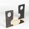 Aubock Bookends 3785 Urban Legend are sculptural bookends in patina with polished brass base. Designed by Carl Auböck and handmade in Austria. Founded in 1906, the workshop is still owned and operated by the Auböck family (by Carl IV and V) from its original home, in a Vienna townhouse. OK has the largest selection of current Werkstätte Auböck production in the US and in stock, ready to ship.