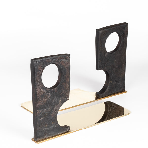 Aubock Bookends 3785 Urban Legend are sculptural bookends in patina with polished brass base. Designed by Carl Auböck and handmade in Austria. Founded in 1906, the workshop is still owned and operated by the Auböck family (by Carl IV and V) from its original home, in a Vienna townhouse. OK has the largest selection of current Werkstätte Auböck production in the US and in stock, ready to ship.