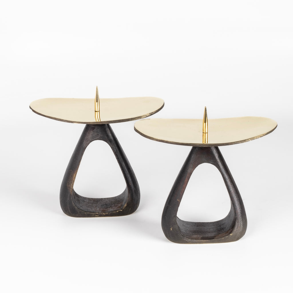 Aubock Candle Holders 3470 with open base are a set of candle holders with open patina brass base and polished top. Designed by Carl Auböck and handmade in Austria. Founded in 1906, the workshop is still owned and operated by the Auböck family (by Carl IV and V) from its original home, in a Vienna townhouse. OK has the largest selection of current Werkstätte Auböck production in the US and in stock, ready to ship.