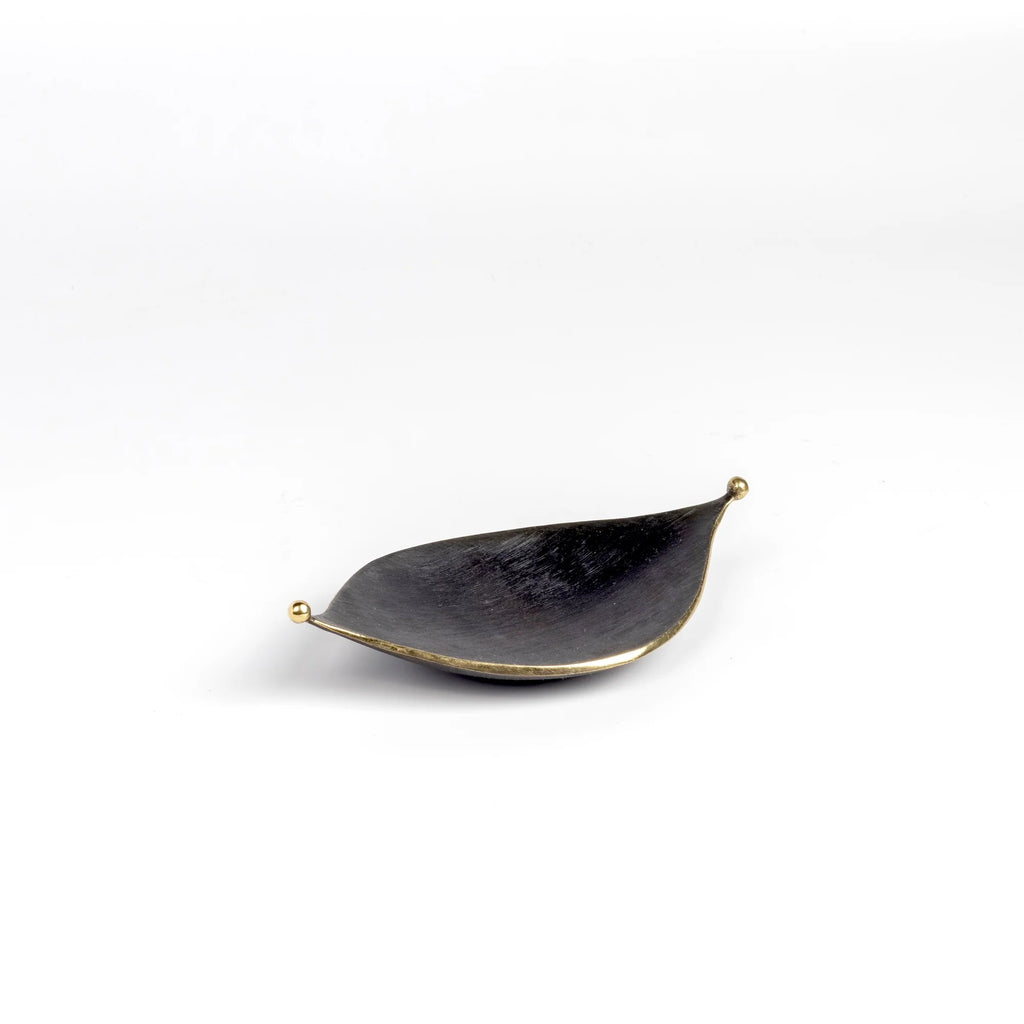 Ashtray Leaf 9431 is an ashtray or bowl shaped like a leaf in patina  brass with polished little balls on each end. Designed by Carl Auböck and handmade in Austria. Founded in 1906, the workshop is still owned and operated by the Auböck family (by Carl IV and from its original home, in a Vienna townhouse.