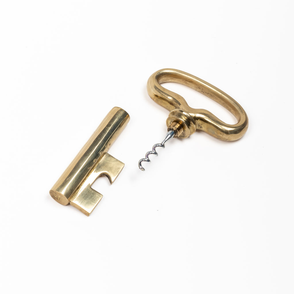 Carl Aubock 3687 Key Corkscrew in brass pulled apart on wite background.