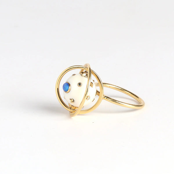 Galaxy Spinning ring by Bibi Van Der Velden on white background.