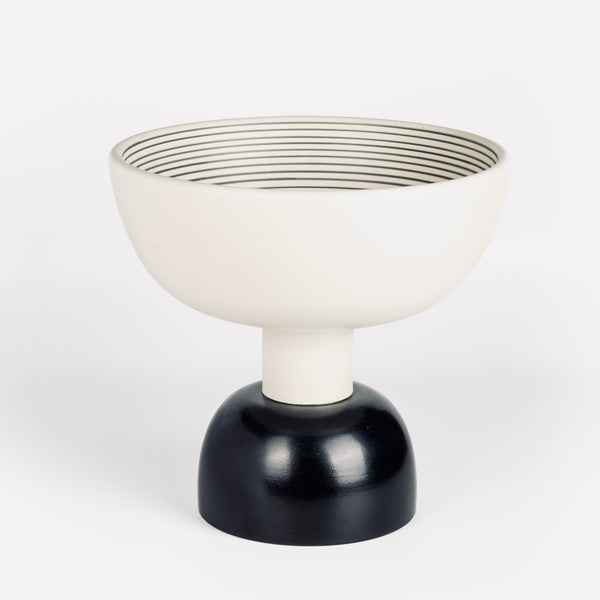Ceramic Sottsass vessel Alzata Grande in black and white stripes on white background.