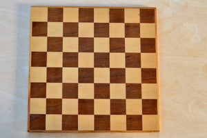 olid wood chess board in walnut and maple.