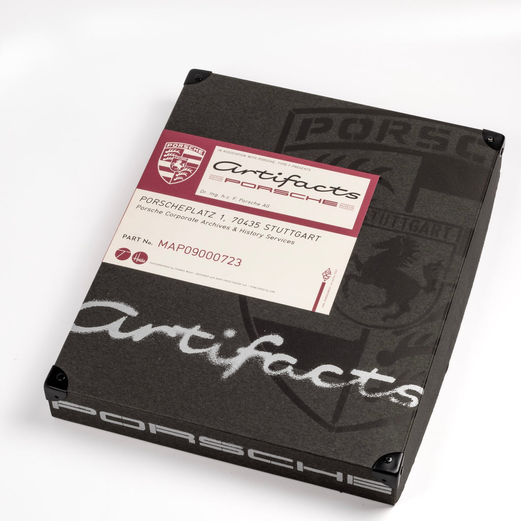 Artifacts Porsche Book published by ERG Media comes Inside an archival folder and is a beautiful book with an deep dive look at the Porsche Historic Archives featuring sketches, notebooks, objects and of course 75 years of Porsche cars. First edition. Rare and hard to find car book.