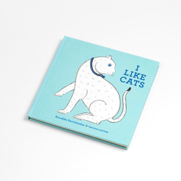 I Like Cats  by Anushka Ravishankar & various artists with blue cover. "Sunny cats, sad cats, grinning cats, bad cats, cats with scowls and cats with jowls..." Written by Anushka Ravishankar with illustrations by various tribal and folk artists in India. This book is for cat lovers. Hand bound with a silk screened cover, It gets republished in India every few years. It is numbered and includes a print.&nbsp;