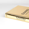 Close up of gold cover and spine of Chanel Haute Couture book by Sofia Coppola and published by Mack Books.