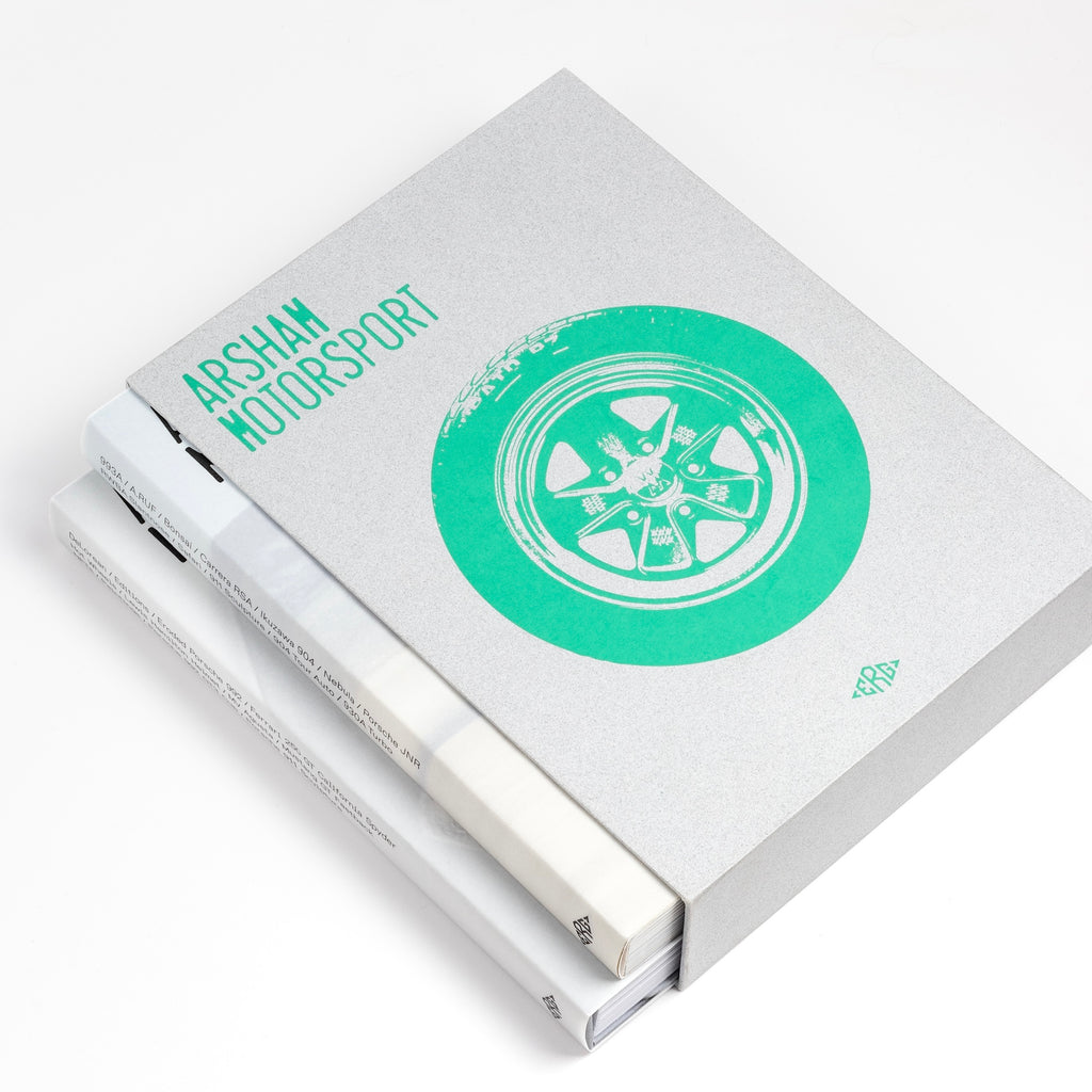 Showing two volumes of First Edition Arsham Motorsport Porsche and art book from ERG Media by Daniel Arsham.