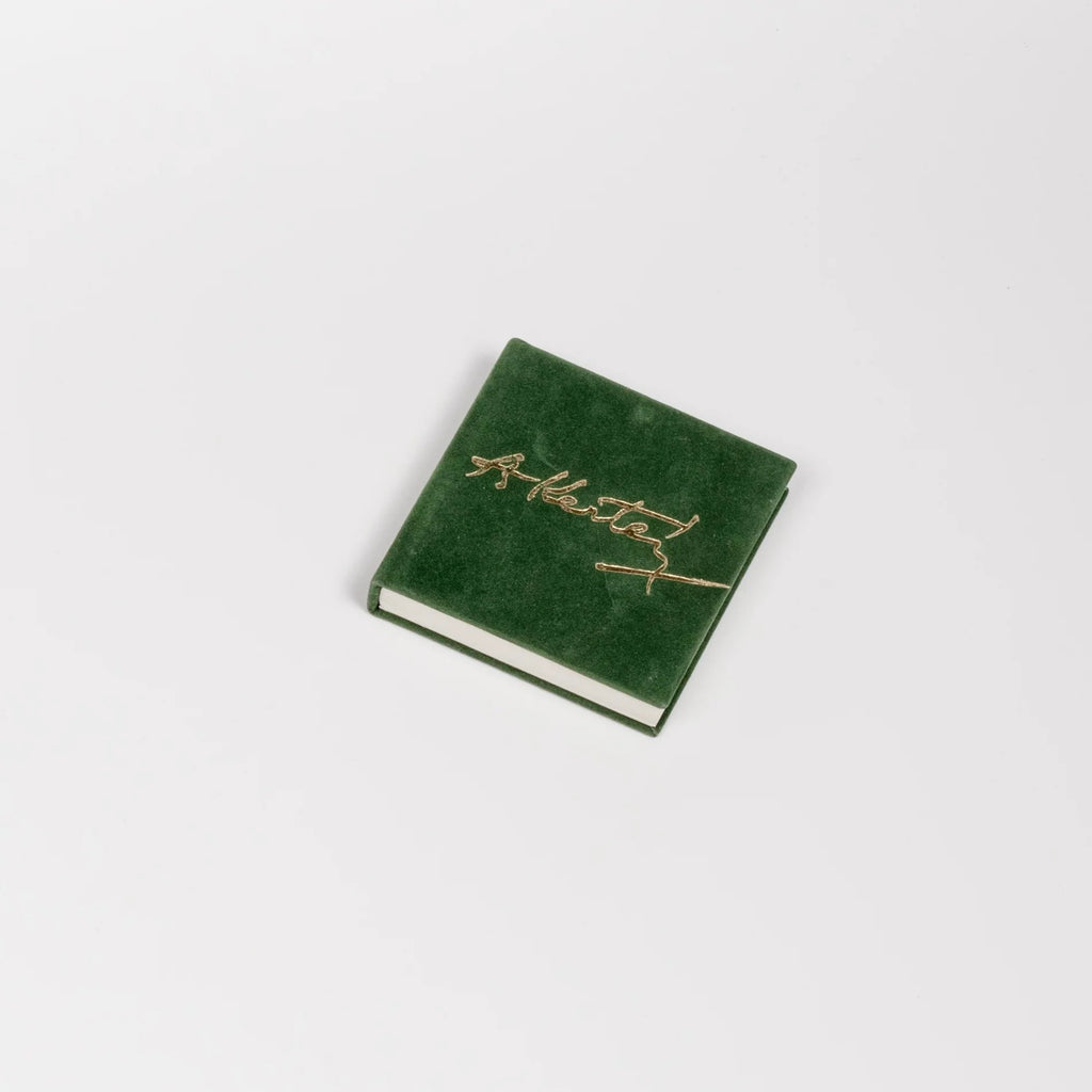 A rare and out of print Andre Kertesz miniature photo book bound in green velvet with gilt lettering that was published by  Szentendre in 1987 with text in Hungarian, German, English and French.