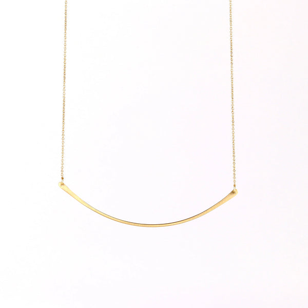 Horizontal Fringe Necklace by Carla Caruso is a  single elongated and shaped fringe bar hangs on an 13.5" chain in 14k yellow gold with satin finish. 