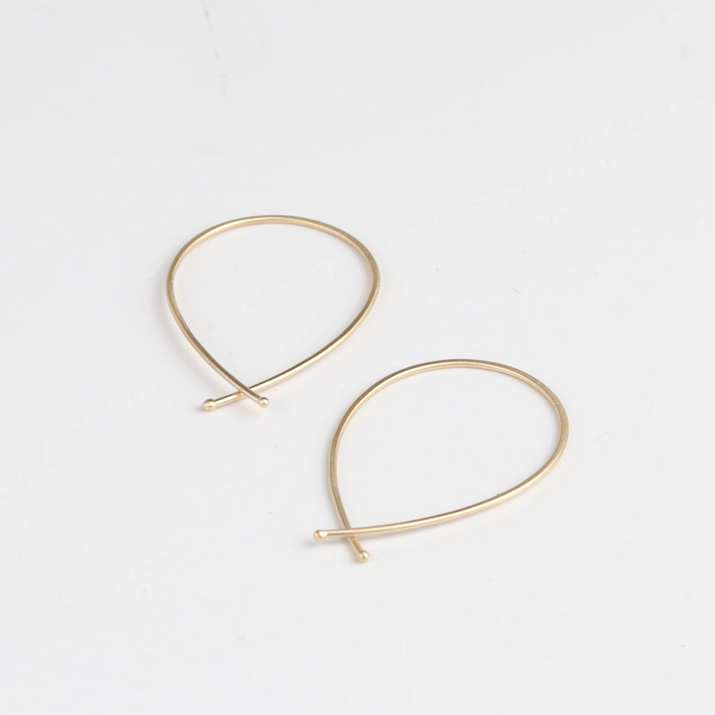 Carla Caruso 14k Yellow Gold Ribbon Hoops in medium.