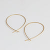 Carla Caruso 14k Yellow Gold Ribbon Hoops in large.