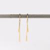 Double Fringe Drop Earrings in 14k yellow satin and matte gold by Carla Caruso on white background.
