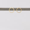 Open Circle Studs Earrings on white background.