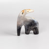 The ceramic creature is a one of a kind figurine formed from solid clay and refined by hand, this "one of a kind" ceramic creature is made out of white earthenware and white terra sigillata before getting pit fired in the wilderness. Made by Carol Horst in Los Angeles.
