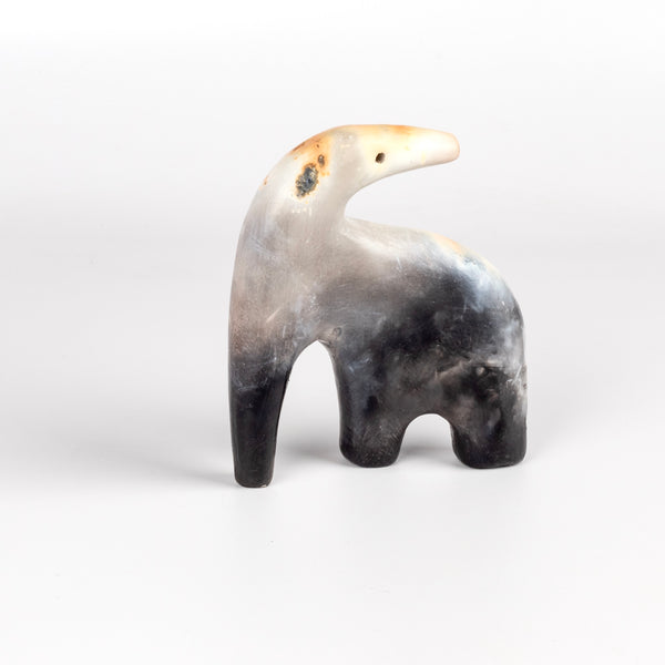 The ceramic creature is a one of a kind figurine formed from solid clay and refined by hand, this "one of a kind" ceramic creature is made out of white earthenware and white terra sigillata before getting pit fired in the wilderness. Made by Carol Horst in Los Angeles.