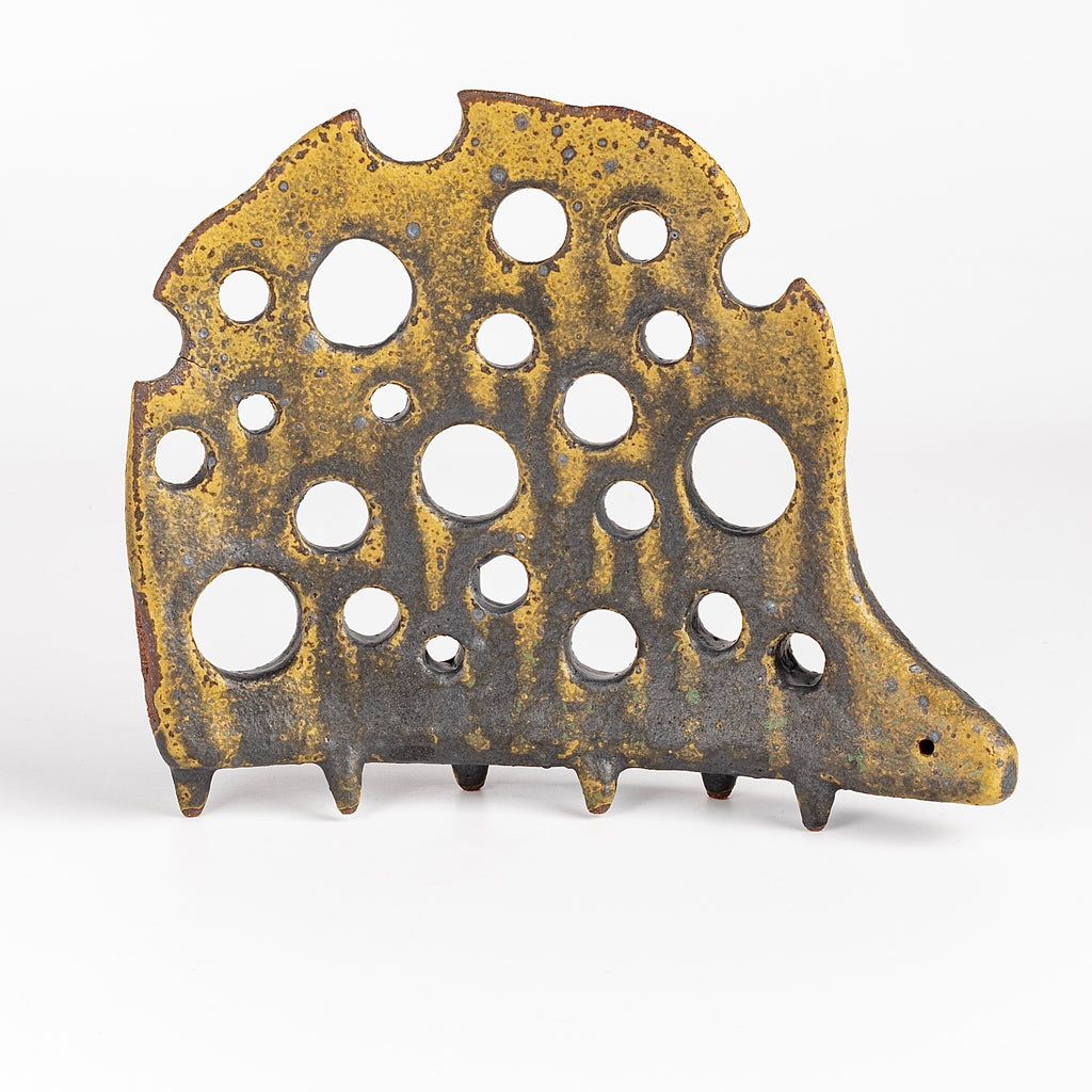 Ceramic Creature 9 is formed from solid clay and refined by hand, this "one of a kind" ceramic creature is made out of stoneware and glazed before getting reduction fired. Made by Carol Horst in Los Angeles.