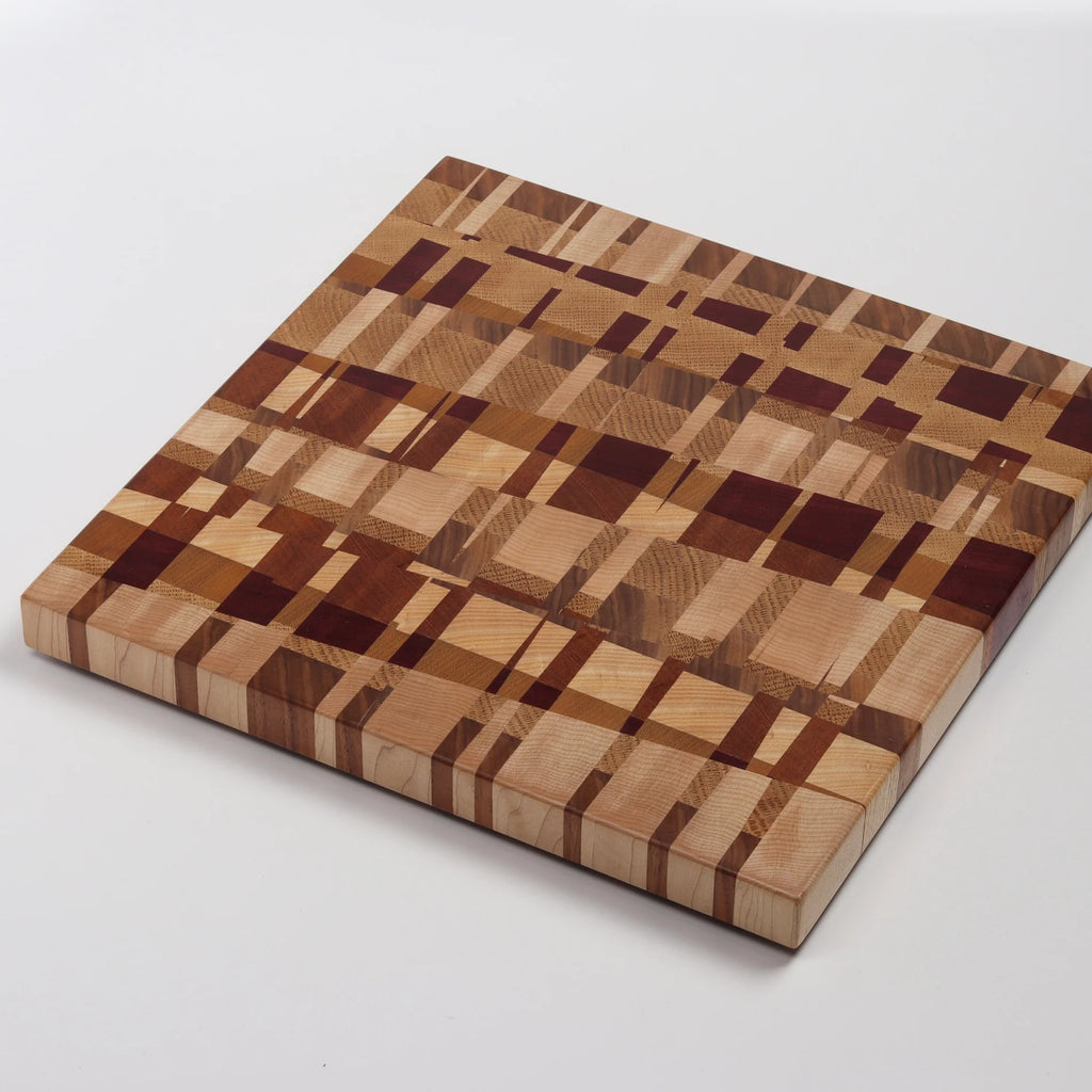 Medium Cutting Board by Chris Karlson Design is a Chock-A-Block Cutting Board made with end grain hard woods and is as good as a chopping block as it is a serving board.