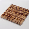 Medium Cutting Board by Chris Karlson Design is a Chock-A-Block Cutting Board made with end grain hard woods and is as good as a chopping block as it is a serving board.