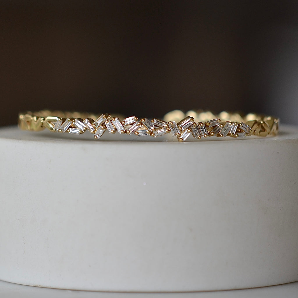 White diamond 18k zig zag bangle fom Suzanne Kalan 1.5CT of white baguette diamonds in firework setting.