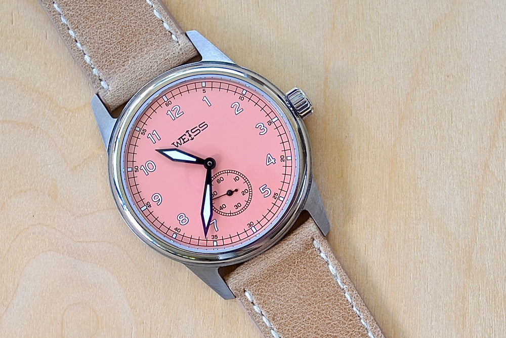 Limited Edition 38MM Standard Issue Field Watch in Pink Sand and titanium by Cameron Weiss. Pink dial and manually wound with American parts, hands and markers. Series of 30.